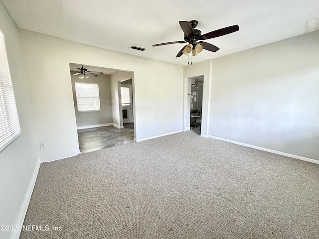 11920 Betula Rd, Jacksonville, FL 32246 - spare room with baseboards, carpet flooring, and visible vents