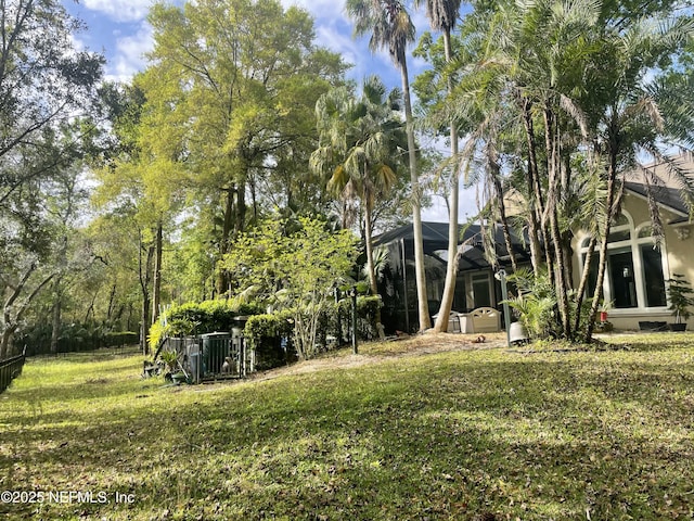 view of yard with a lanai