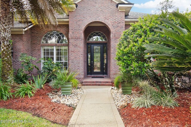 553 S Bridge Creek Dr, Saint Johns, FL 32259 - entrance to property with a shingled roof and brick siding