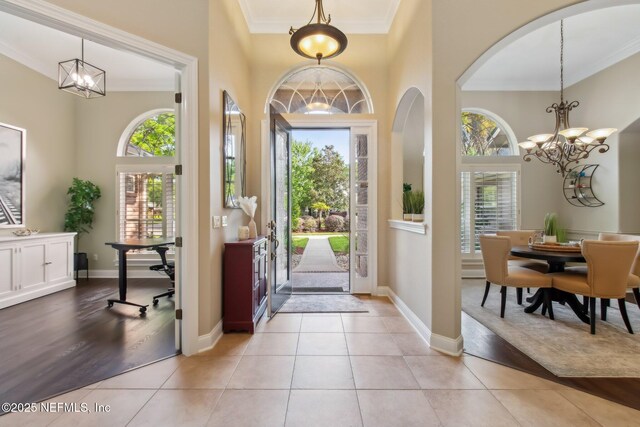 553 S Bridge Creek Dr, Saint Johns, FL 32259 - foyer entrance with an inviting chandelier, crown molding, and a healthy amount of sunlight