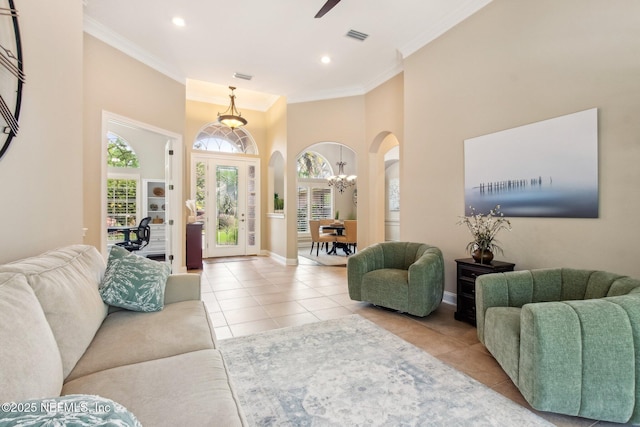553 S Bridge Creek Dr, Saint Johns, FL 32259 - living area with arched walkways, ornamental molding, visible vents, and tile patterned floors