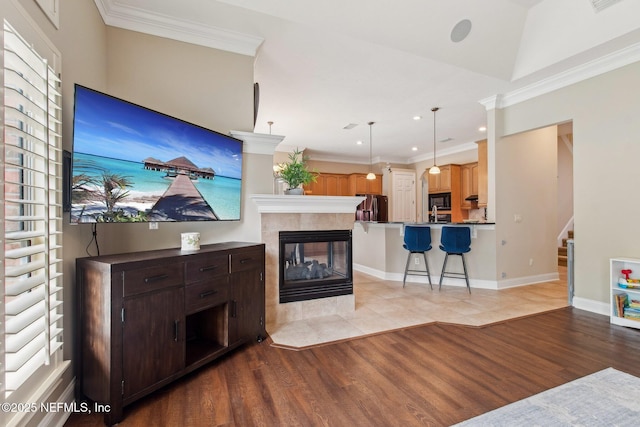 553 S Bridge Creek Dr, Saint Johns, FL 32259 - living area with a fireplace, stairs, ornamental molding, and wood finished floors