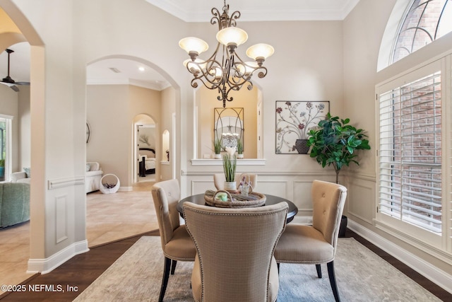 553 S Bridge Creek Dr, Saint Johns, FL 32259 - dining space featuring arched walkways, a decorative wall, crown molding, and a notable chandelier