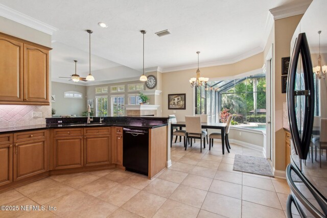 553 S Bridge Creek Dr, Saint Johns, FL 32259 - kitchen featuring tasteful backsplash, stainless steel fridge, brown cabinets, black dishwasher, and ornamental molding