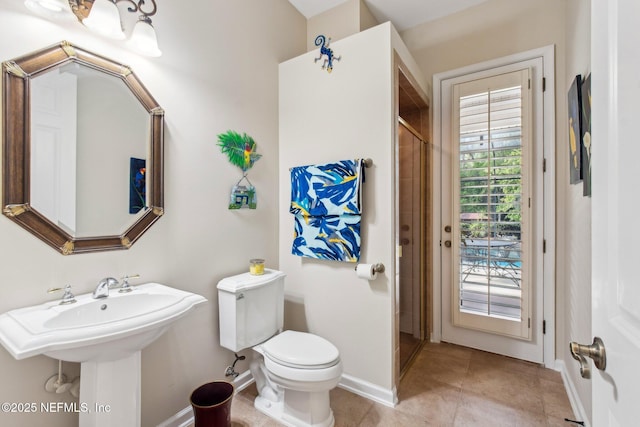 553 S Bridge Creek Dr, Saint Johns, FL 32259 - full bathroom featuring walk in shower, baseboards, toilet, tile patterned floors, and a sink