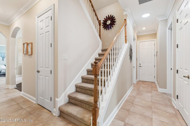 553 S Bridge Creek Dr, Saint Johns, FL 32259 - stairway featuring recessed lighting, ornamental molding, baseboards, tile patterned floors, and arched walkways