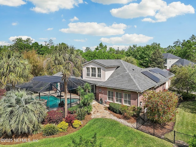 553 S Bridge Creek Dr, Saint Johns, FL 32259 - back of property featuring a fenced in pool, fence, brick siding, a lanai, and a yard