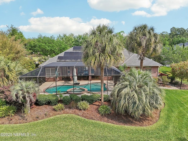 553 S Bridge Creek Dr, Saint Johns, FL 32259 - view of pool with a pool with connected hot tub, glass enclosure, a patio area, and a lawn