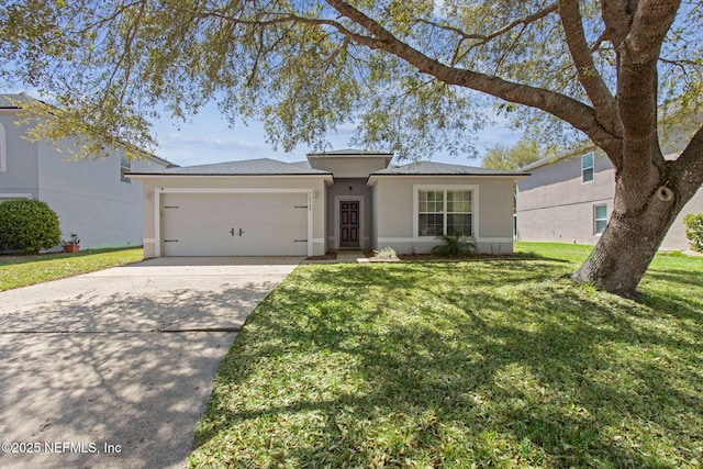view of front of house featuring a front yard, concrete driveway, stucco siding, and an attached garage