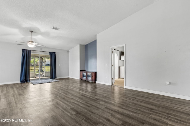 unfurnished living room with vaulted ceiling, wood finished floors, a textured ceiling, visible vents, and ceiling fan