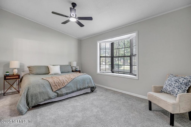 bedroom with baseboards, ornamental molding, lofted ceiling, and carpet floors