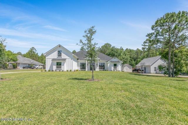 9921 Derby Gate Ct, Jacksonville, FL 32219 - modern farmhouse featuring a front lawn and board and batten siding