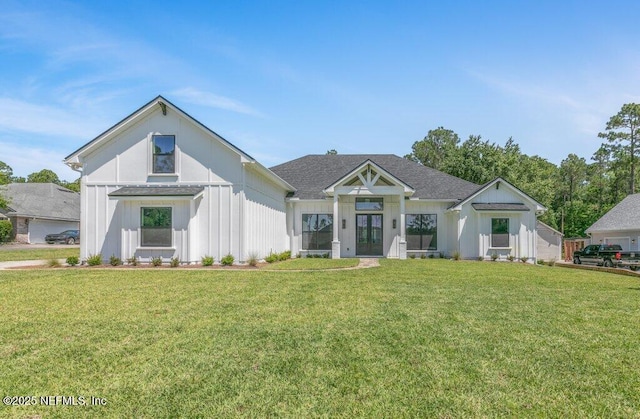 9921 Derby Gate Ct, Jacksonville, FL 32219 - modern inspired farmhouse featuring french doors, a front lawn, board and batten siding, and a shingled roof