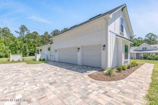 9921 Derby Gate Ct, Jacksonville, FL 32219 - garage featuring decorative driveway