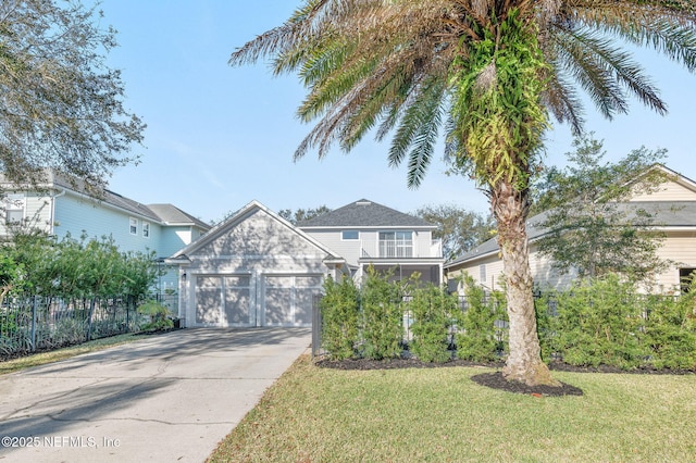424 High Tide Dr, Saint Augustine, FL 32080 - traditional-style home with a front yard, an attached garage, fence, and concrete driveway