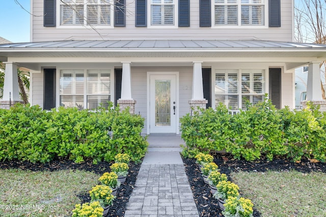 424 High Tide Dr, Saint Augustine, FL 32080 - property entrance with a porch, a standing seam roof, and metal roof