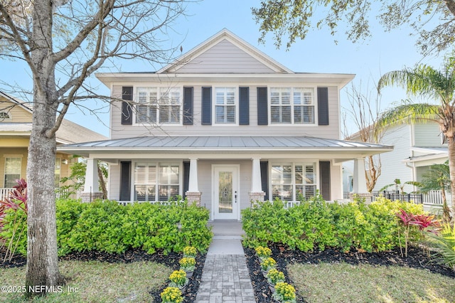 424 High Tide Dr, Saint Augustine, FL 32080 - view of front of property with a standing seam roof, a porch, and metal roof