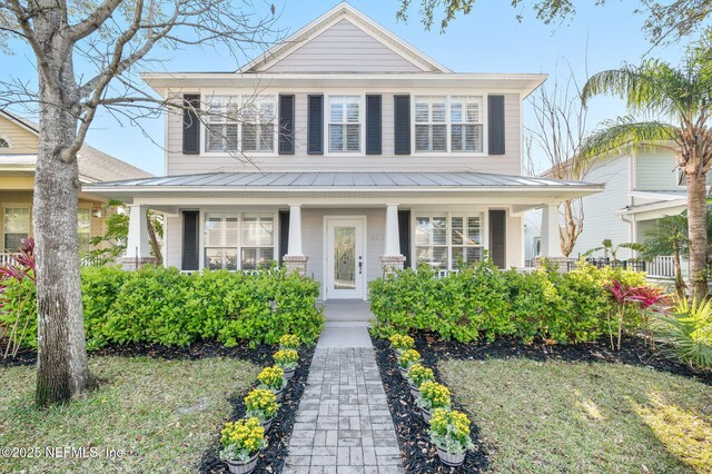 424 High Tide Dr, Saint Augustine, FL 32080 - traditional style home featuring a porch, a standing seam roof, and metal roof