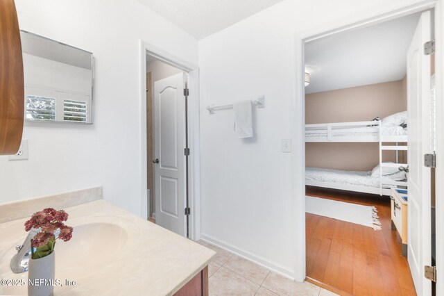 424 High Tide Dr, Saint Augustine, FL 32080 - bathroom featuring tile patterned floors, vanity, and baseboards