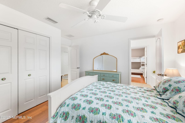 424 High Tide Dr, Saint Augustine, FL 32080 - bedroom featuring visible vents, ceiling fan, a closet, and wood finished floors