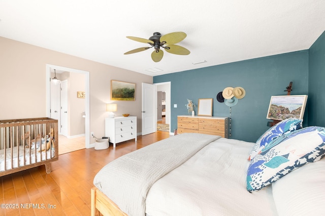 424 High Tide Dr, Saint Augustine, FL 32080 - bedroom featuring baseboards, a ceiling fan, and wood finished floors