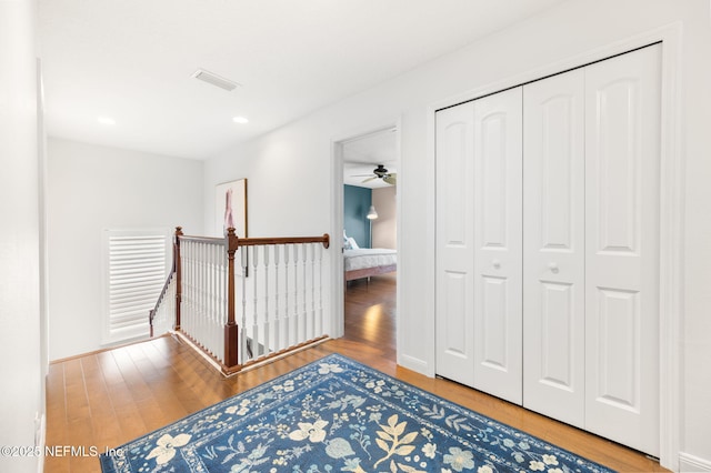 424 High Tide Dr, Saint Augustine, FL 32080 - hall with visible vents, recessed lighting, wood finished floors, an upstairs landing, and baseboards