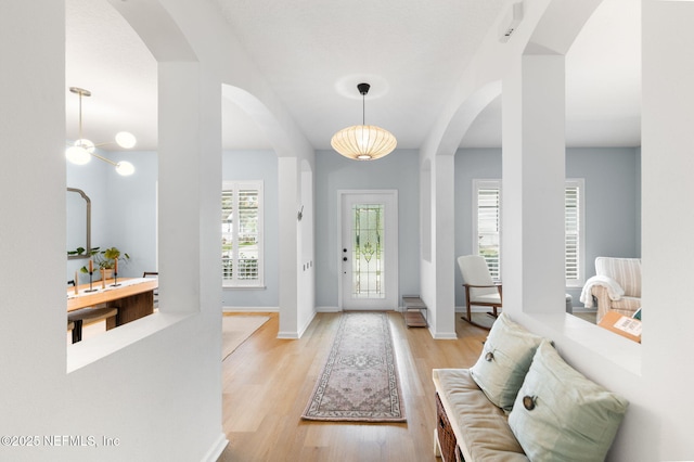 424 High Tide Dr, Saint Augustine, FL 32080 - foyer featuring light wood-type flooring, baseboards, and arched walkways