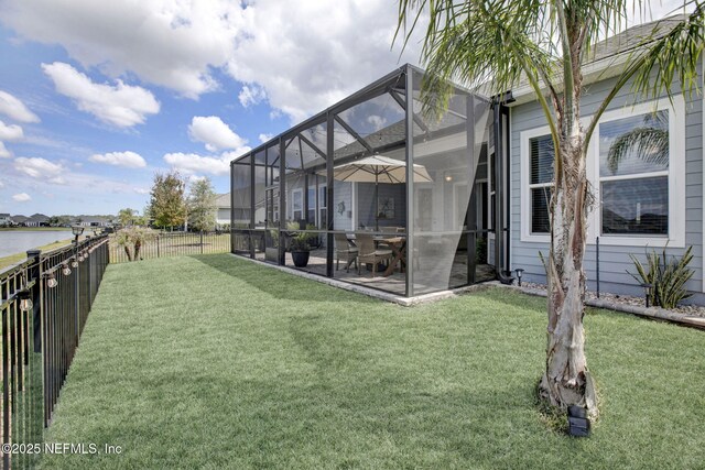 559 Willow Lake Dr, Saint Augustine, FL 32092 - view of yard featuring a fenced backyard, a water view, a lanai, and a patio