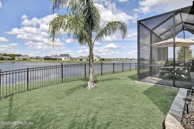 559 Willow Lake Dr, Saint Augustine, FL 32092 - view of yard featuring glass enclosure, a fenced backyard, a residential view, a patio, and a water view