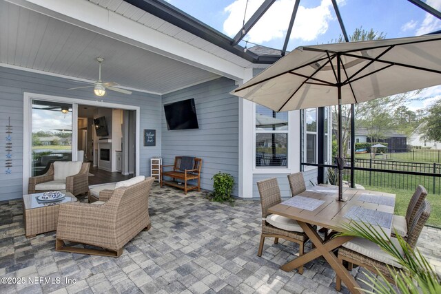 559 Willow Lake Dr, Saint Augustine, FL 32092 - view of patio featuring a lanai, fence, outdoor dining space, and a ceiling fan