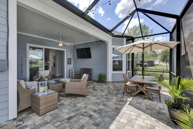 559 Willow Lake Dr, Saint Augustine, FL 32092 - view of patio with glass enclosure, outdoor dining space, and a ceiling fan