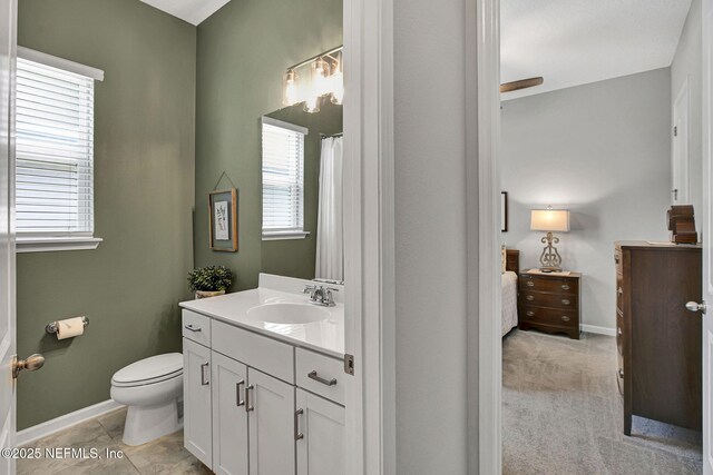 559 Willow Lake Dr, Saint Augustine, FL 32092 - bathroom featuring baseboards, toilet, and vanity