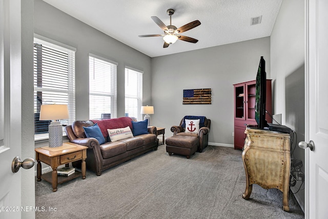 559 Willow Lake Dr, Saint Augustine, FL 32092 - living area featuring carpet flooring, a textured ceiling, visible vents, baseboards, and ceiling fan