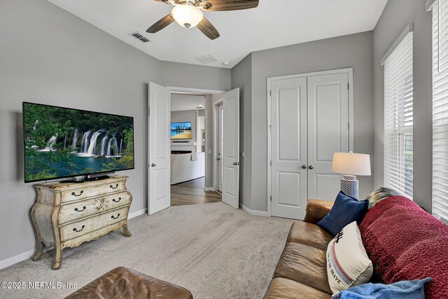 559 Willow Lake Dr, Saint Augustine, FL 32092 - carpeted living area with baseboards, visible vents, and a ceiling fan