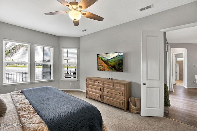 559 Willow Lake Dr, Saint Augustine, FL 32092 - carpeted bedroom with baseboards, visible vents, and a ceiling fan