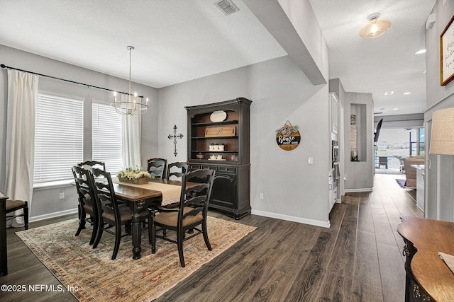 559 Willow Lake Dr, Saint Augustine, FL 32092 - dining room featuring a textured ceiling, visible vents, a chandelier, baseboards, and dark wood finished floors