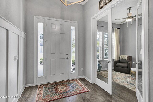 559 Willow Lake Dr, Saint Augustine, FL 32092 - entrance foyer with french doors, dark wood-style flooring, baseboards, and ceiling fan