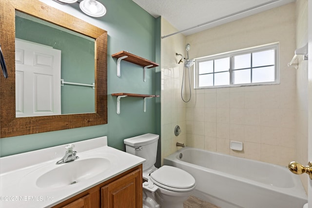 bathroom with toilet, vanity, bathing tub / shower combination, and a textured ceiling