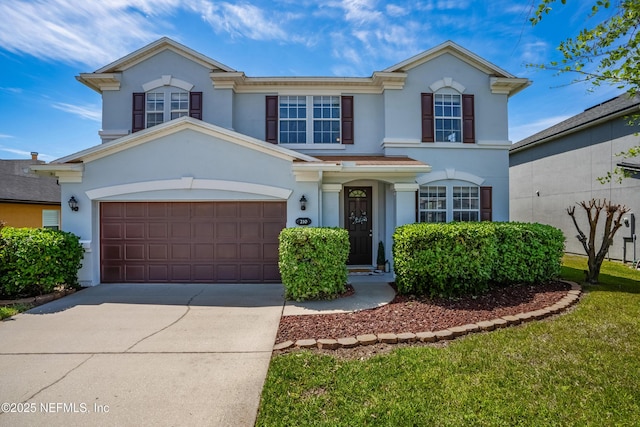 210 Crown Wheel Cir, Saint Johns, FL 32259 - view of front of house featuring stucco siding, concrete driveway, and a garage