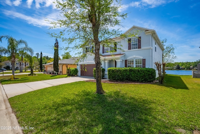 210 Crown Wheel Cir, Saint Johns, FL 32259 - traditional home with concrete driveway, a front yard, and stucco siding