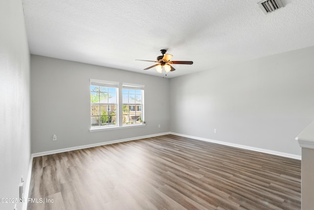 210 Crown Wheel Cir, Saint Johns, FL 32259 - empty room featuring a ceiling fan, wood finished floors, and a textured ceiling