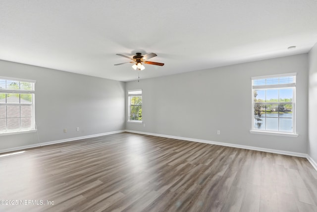 210 Crown Wheel Cir, Saint Johns, FL 32259 - empty room featuring ceiling fan and dark wood-type flooring