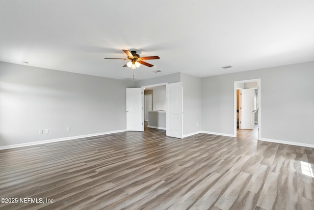 210 Crown Wheel Cir, Saint Johns, FL 32259 - unfurnished living room featuring a ceiling fan and wood finished floors