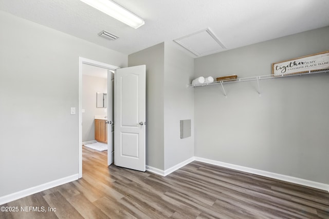 210 Crown Wheel Cir, Saint Johns, FL 32259 - laundry room featuring wood finished floors and baseboards