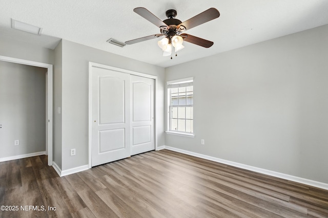 210 Crown Wheel Cir, Saint Johns, FL 32259 - unfurnished bedroom with wood finished floors, a closet, and ceiling fan