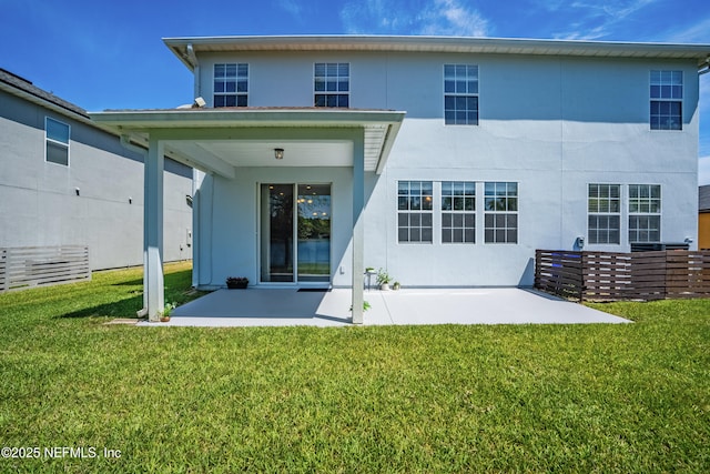 210 Crown Wheel Cir, Saint Johns, FL 32259 - rear view of house featuring stucco siding, a patio area, and a yard