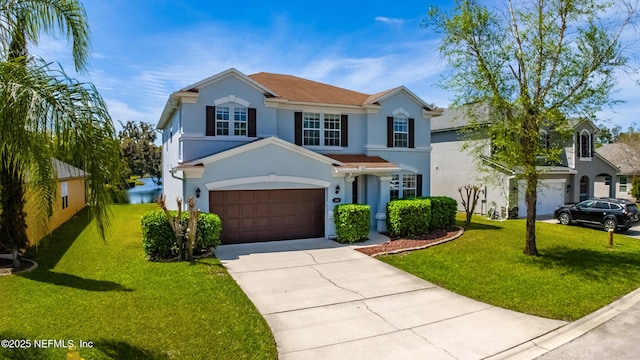 210 Crown Wheel Cir, Saint Johns, FL 32259 - traditional home featuring driveway, stucco siding, and a front lawn