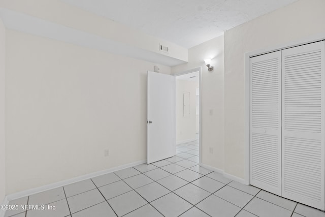 731 1st St S Unit 418, Jacksonville Beach, FL 32250 - unfurnished room with light tile patterned flooring, baseboards, visible vents, and a textured ceiling
