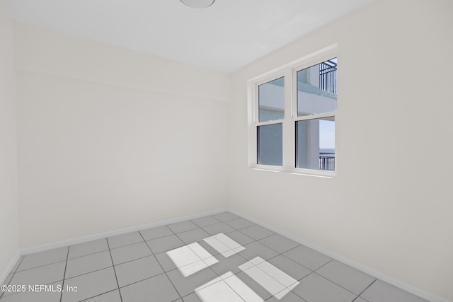731 1st St S Unit 418, Jacksonville Beach, FL 32250 - unfurnished room with light tile patterned flooring and baseboards
