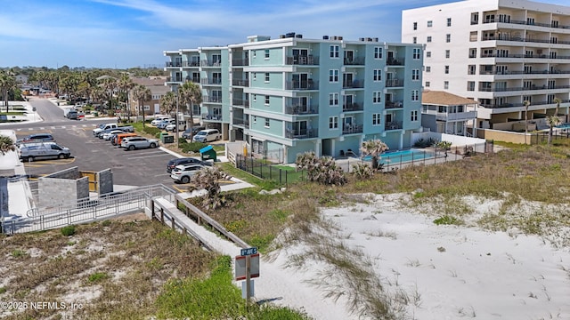 731 1st St S Unit 418, Jacksonville Beach, FL 32250 - view of building exterior featuring uncovered parking